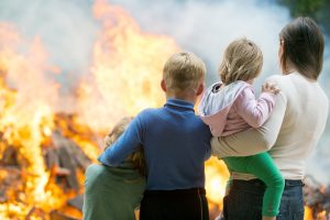 Family watching fire from safe distance