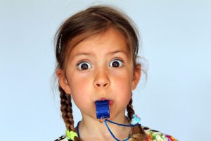 Child blowing whistle
